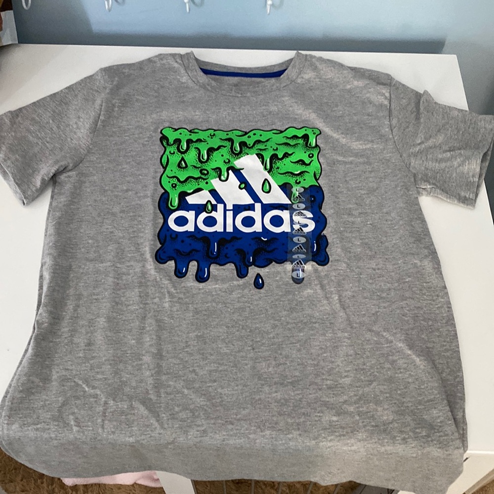 New with tag, Adidas graphic T-shirt, dark blue and green primary colors on gray